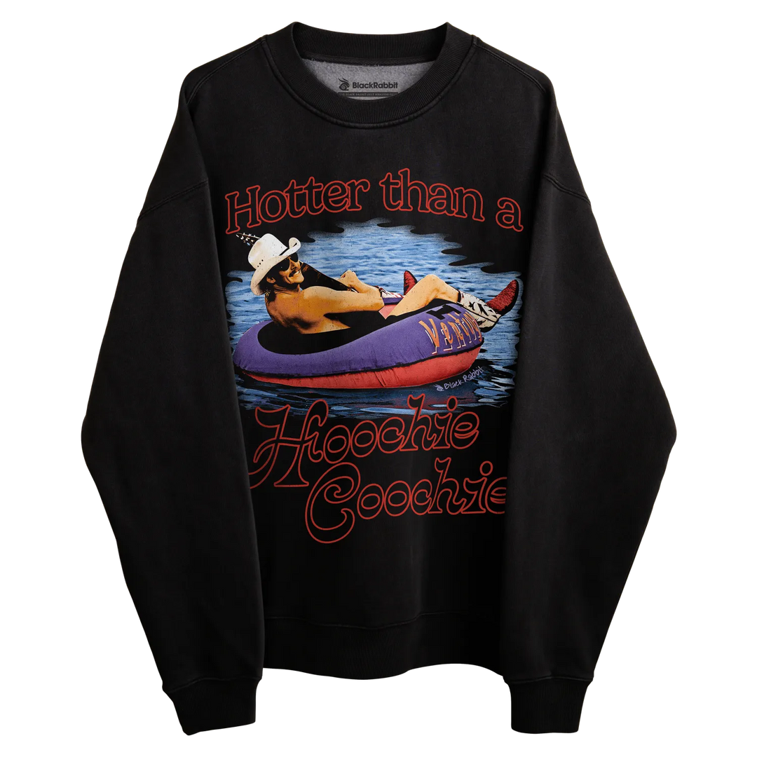 Black crewneck sweatshirt with graphic design of a person in an inner tube on water, wearing cowboy hat and sunglasses.