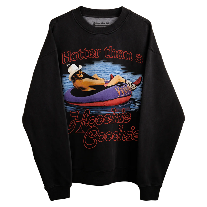 Black crewneck sweatshirt with graphic design of a person in an inner tube on water, wearing cowboy hat and sunglasses.
