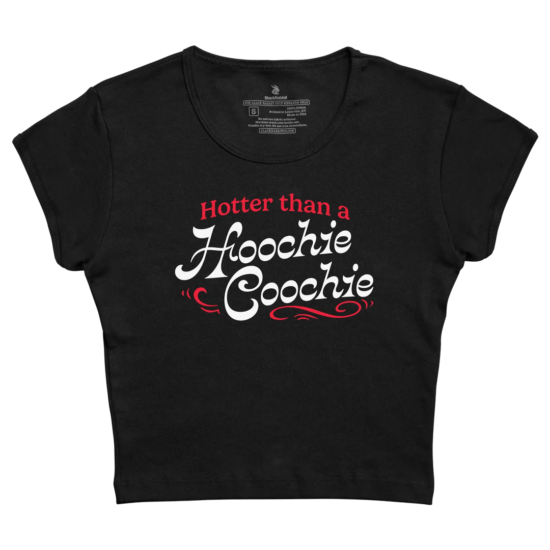 Black cropped t-shirt with ’hotter than a hoochie coochie’ printed in red and white script.