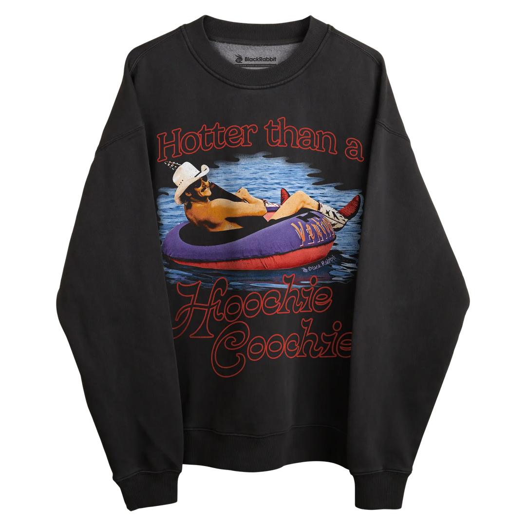 Black sweatshirt with graphic design of woman in inflatable tube on water, ’hotter than a hippie coochie’ text.