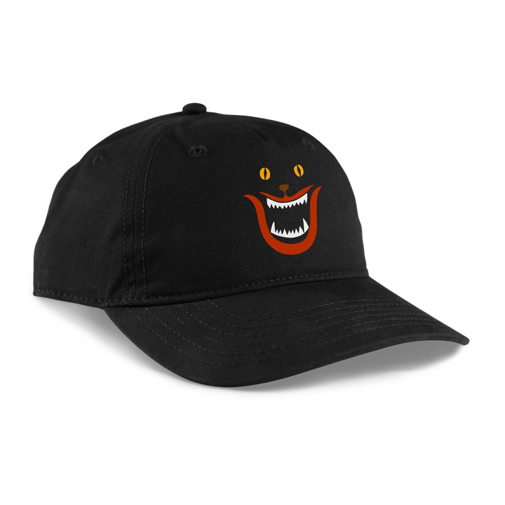 Black baseball cap featuring a cartoon cat face with orange eyes, an open mouth showing white teeth, and red accents on the cheeks.