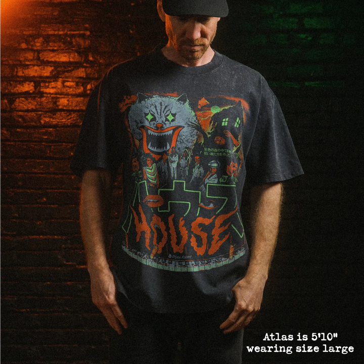 Male model wearing stone wash heavy tee with hausu graphic 