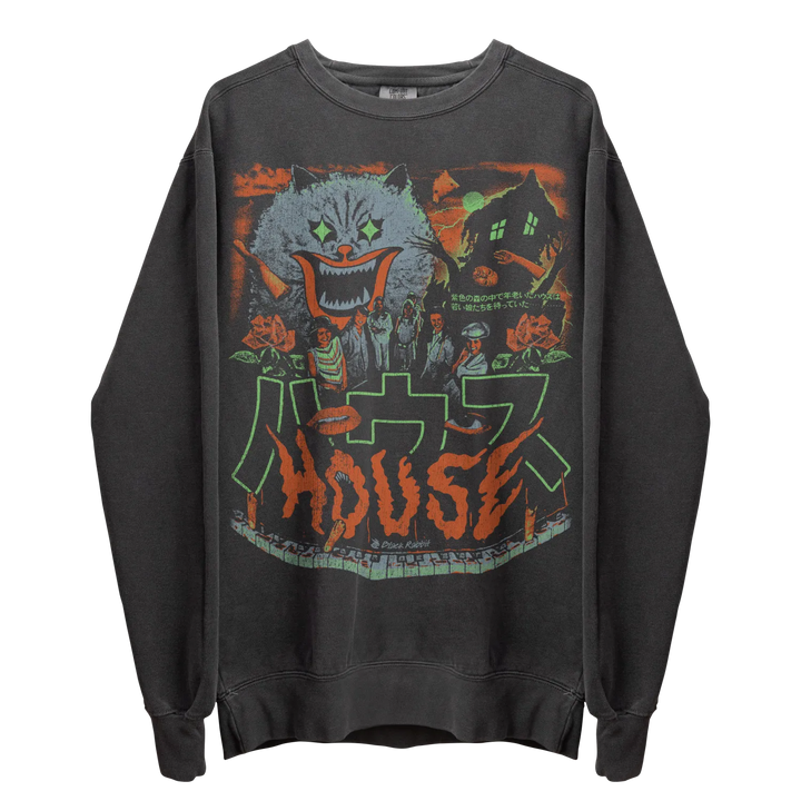 A dark grey crewneck sweatshirt with a colorful graphic print featuring a monstrous cat face, a haunted house, various figures, and the word ’HOUSE’ in a stylized font, along with Japanese characters.