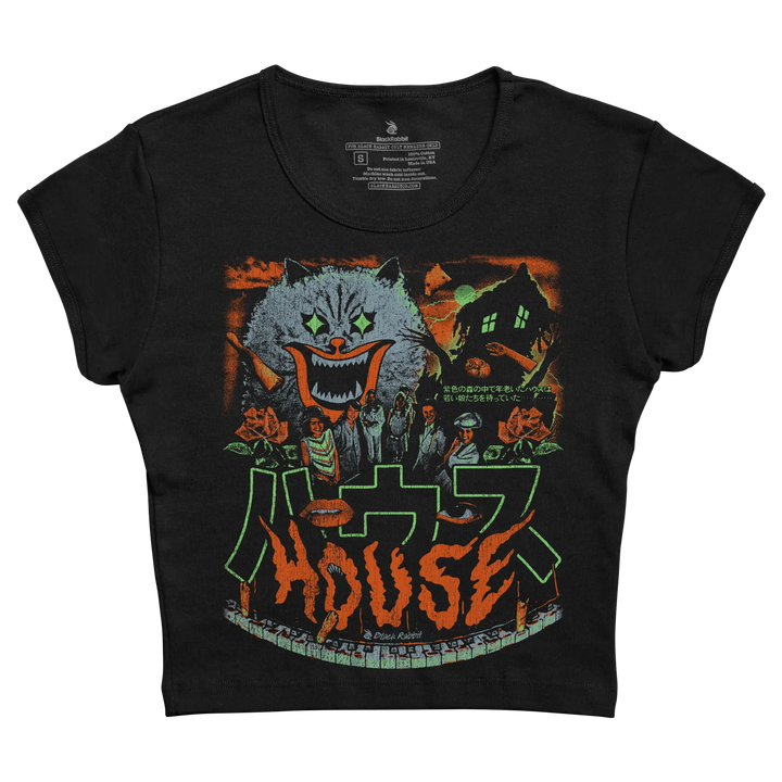 Black short-sleeved t-shirt featuring a vibrant, horror-themed graphic of a menacing cat with glowing green eyes and an orange mouth, set against a backdrop of a haunted house and stylized japanese text. 