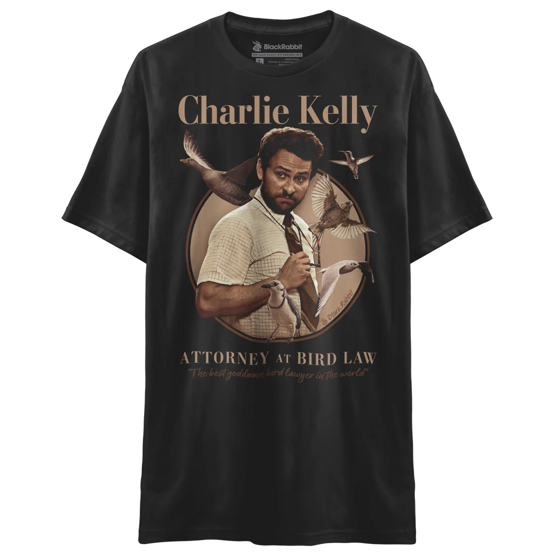 Black t-shirt with charlie kelly graphic and text ’attorney at bird law’ in gold.