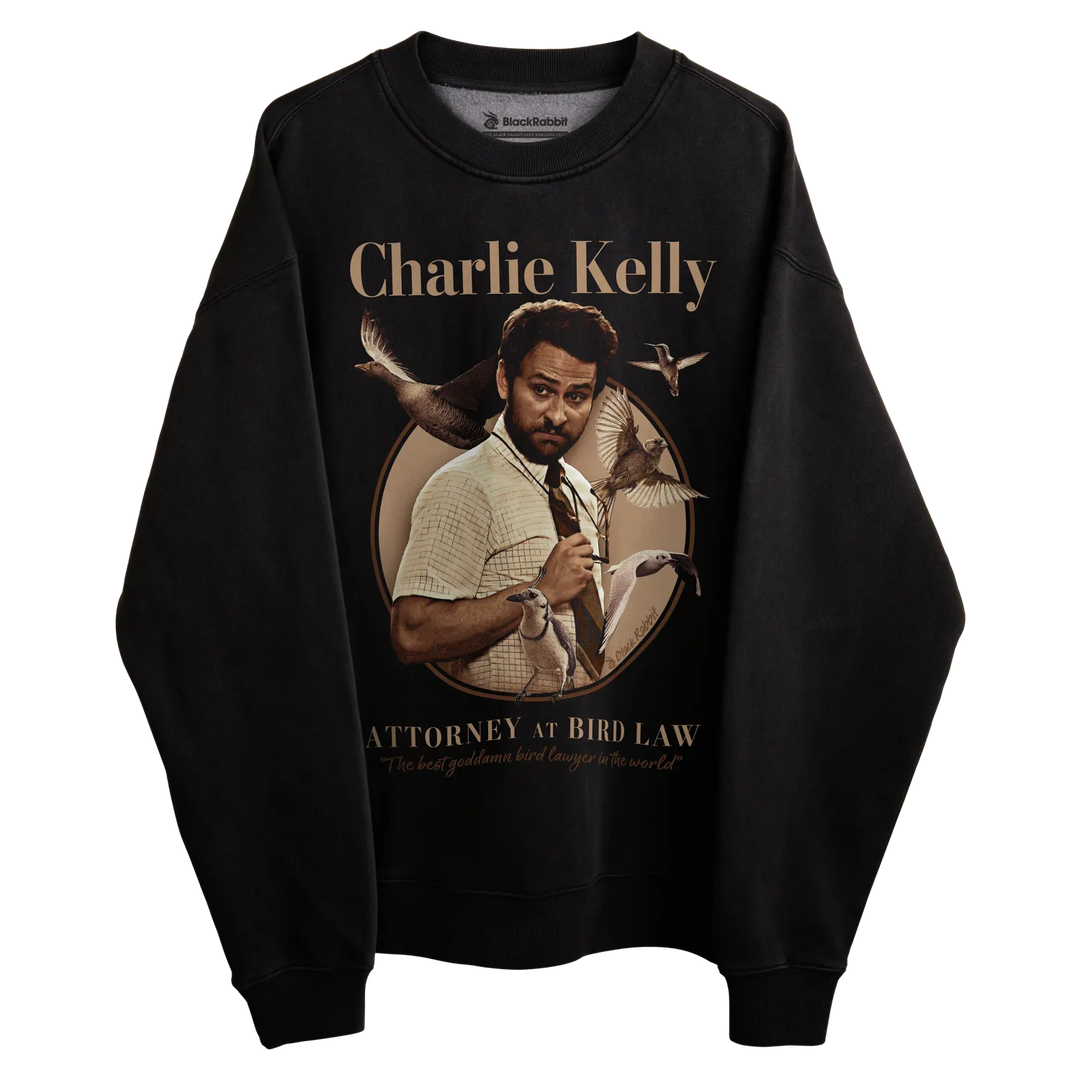 Black crewneck sweatshirt with charlie kelly graphic and text design. 
