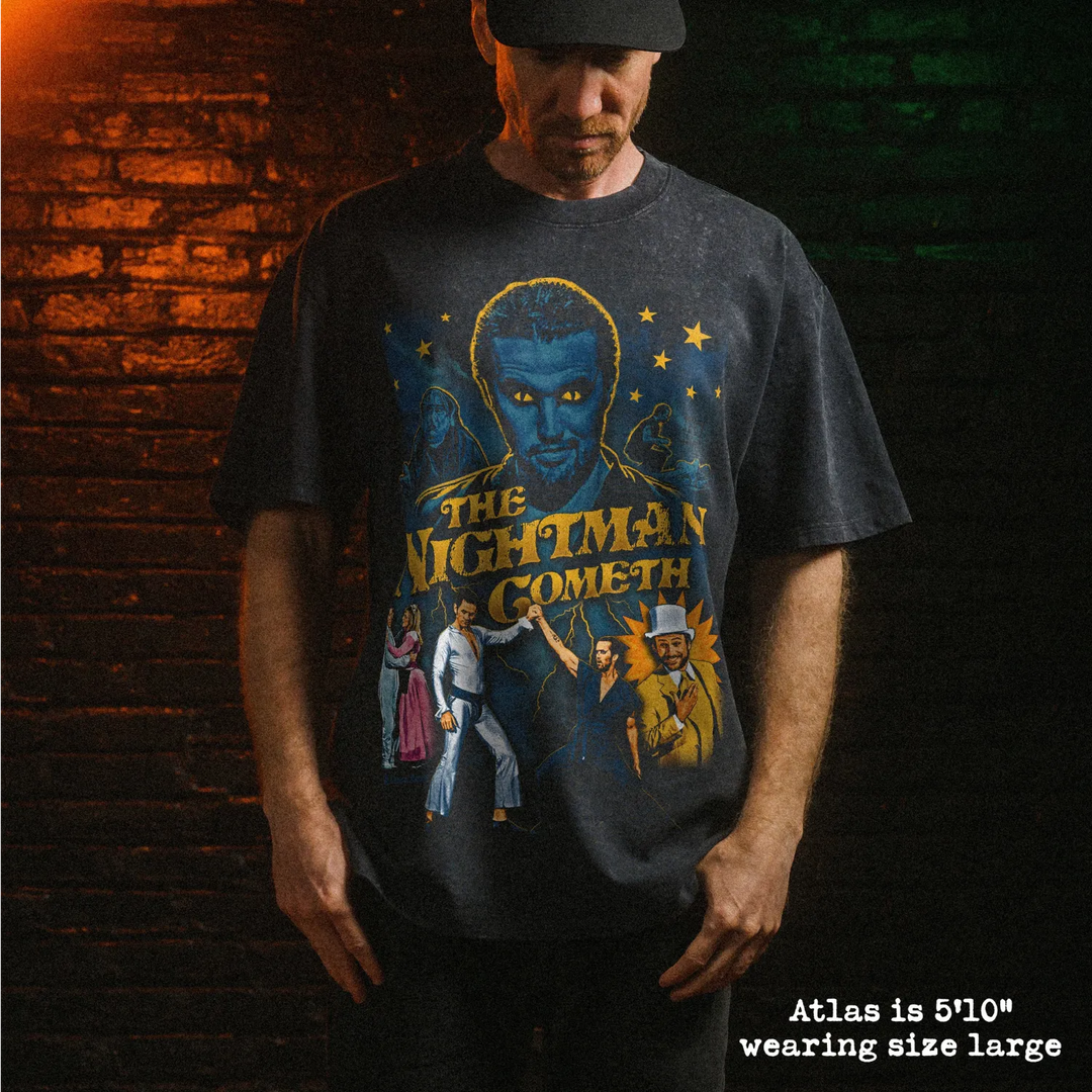 Male model wearing heavy stone washed tee with nightman graphic. 