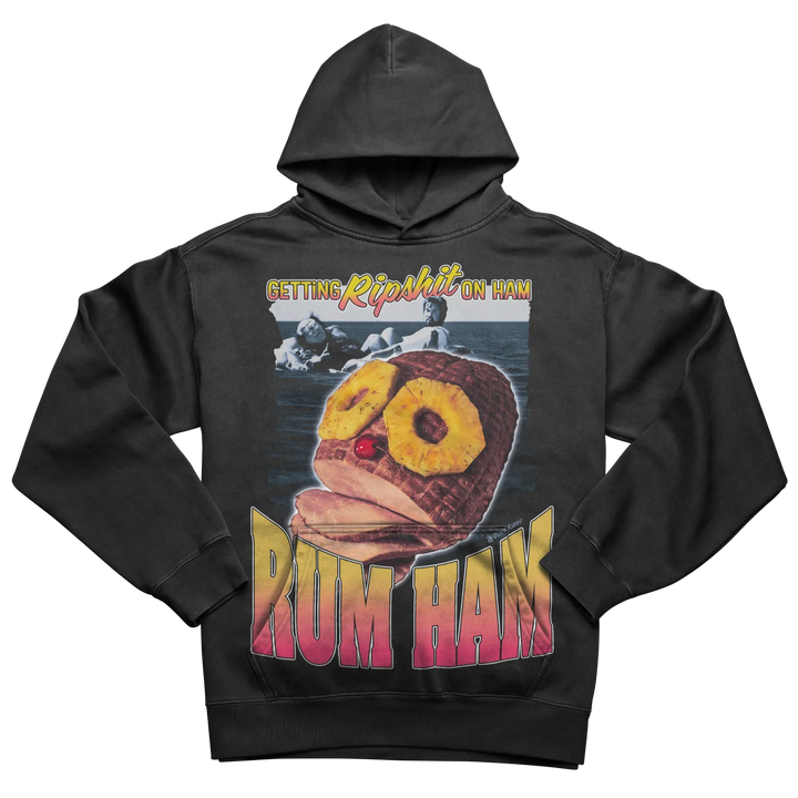 Black hoodie with a graphic print of a ham with pineapple rings and a cherry, and the text ’GETTING RIPSHIT ON HAM’ and ’RUM HAM’.