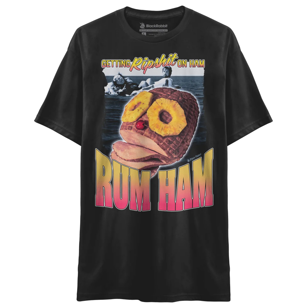 Black t-shirt with a graphic of a ham wearing sunglasses and a cherry nose, and the text ’GETTING RIPSHIT ON HAM’ and ’RUM HAM’.