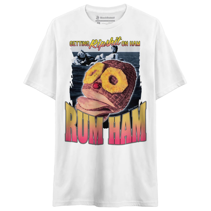 White short-sleeve t-shirt with a graphic print featuring a ham with pineapple slices as eyes and the words ’GETTING RIPSHIT ON HAM’ and ’RUM HAM.’