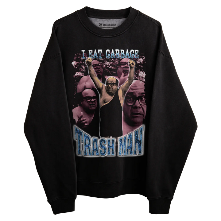 Black long-sleeved sweatshirt with graphic design featuring ’trash man’ and ’i eat garbage’ text, multiple faces printed on the front.