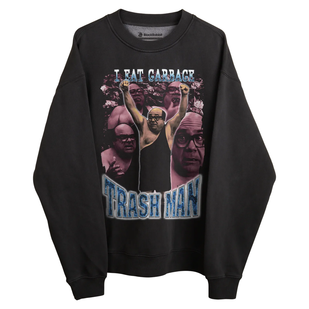 Black crewneck sweatshirt with graphic design featuring a man and text ’i eat garbage’ in white, blue, purple, pink, yellow, green, red, orange, brown, gray, beige.