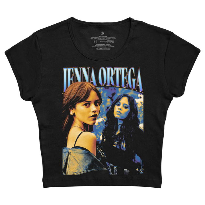 Black short-sleeved t-shirt featuring a vibrant graphic of jenna ortega with stylized blue and white lettering above her image. 