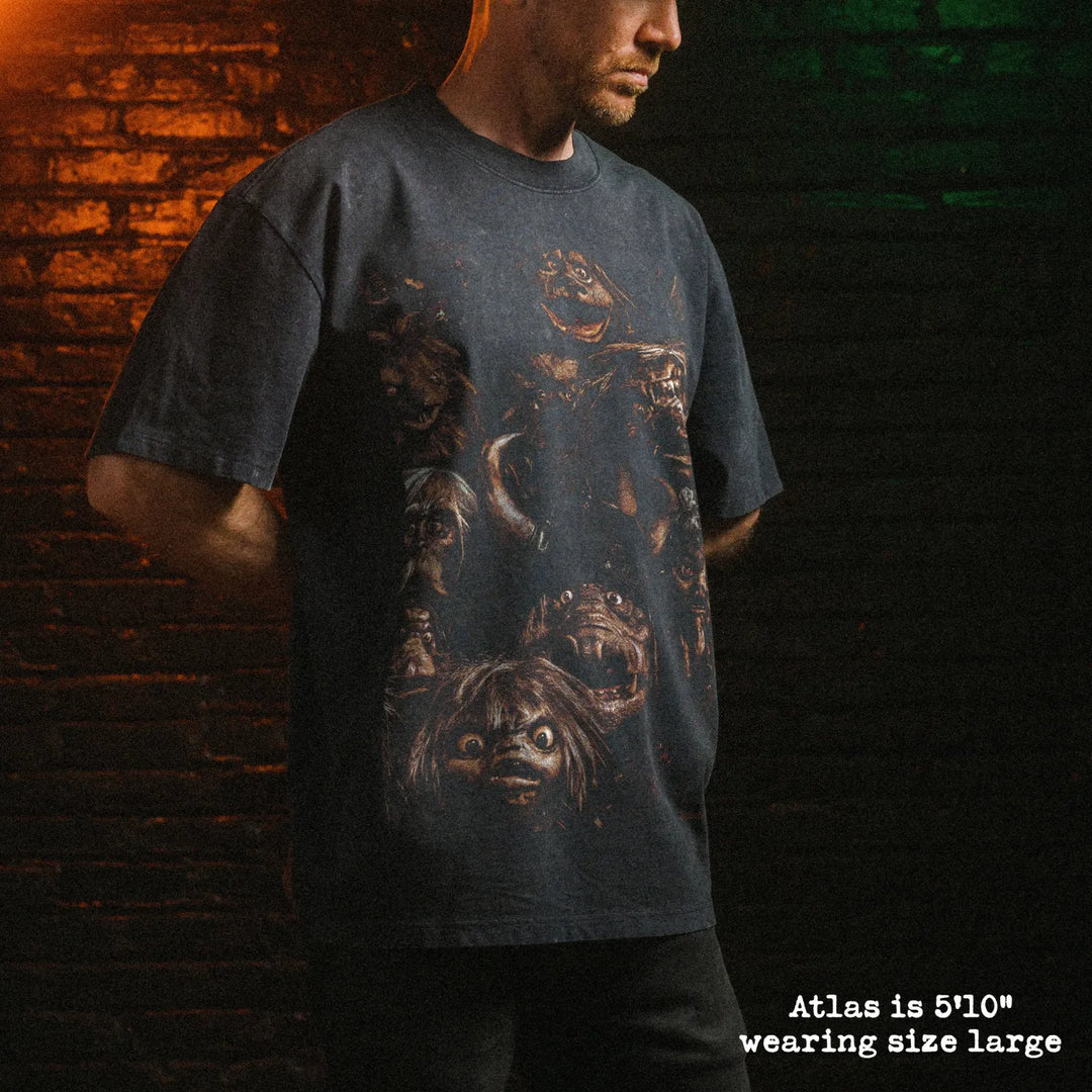 Male model wearing stone wash heavy tee with goblins graphic 
