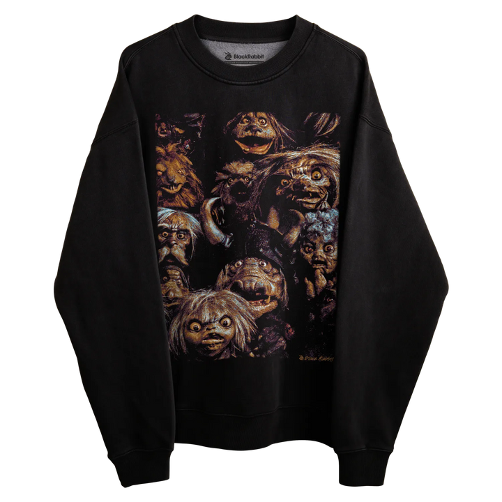 Black sweatshirt with colorful monster faces design, inspired by the movie ’the dark crystal’
