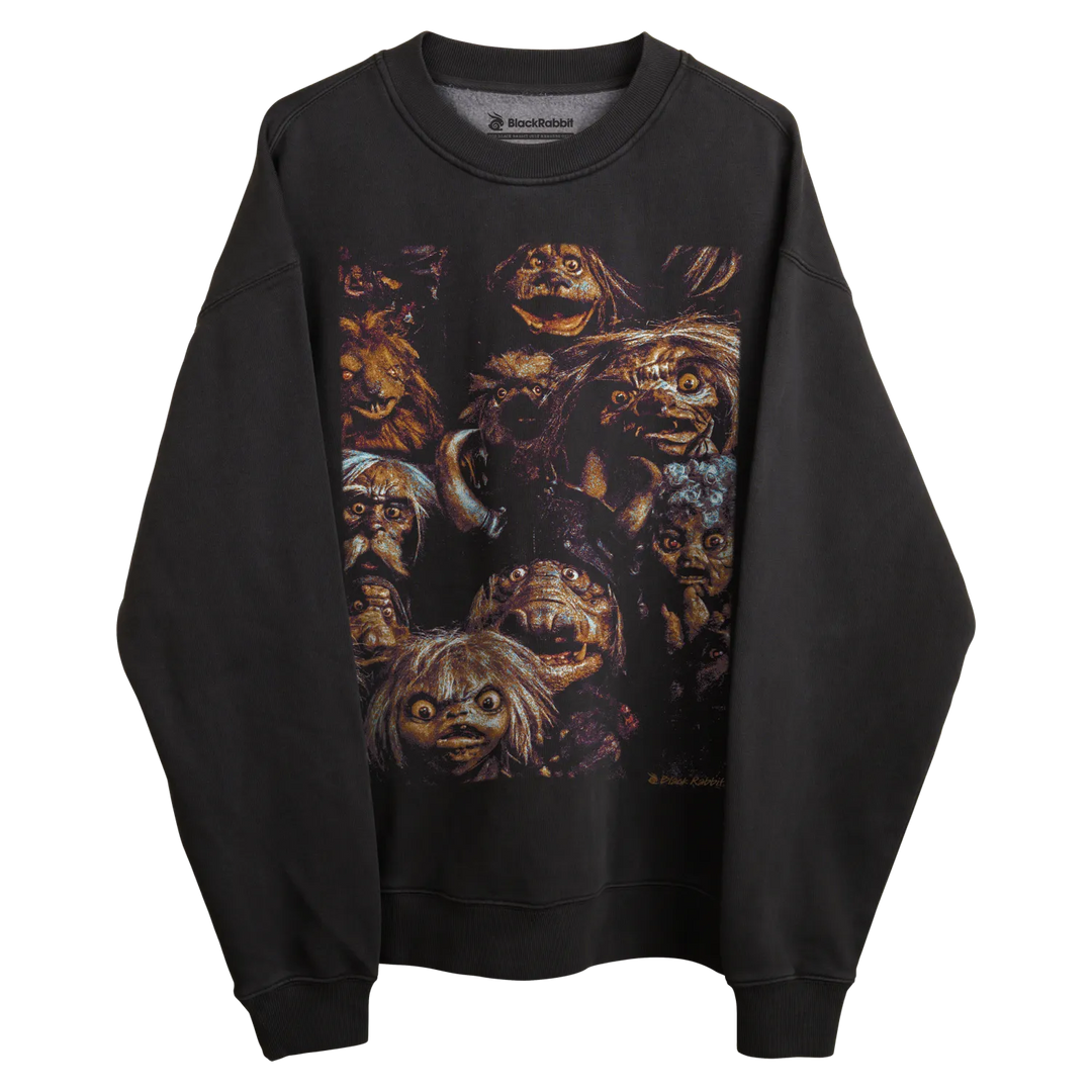 Black sweatshirt with colorful monster design, buckle brand.