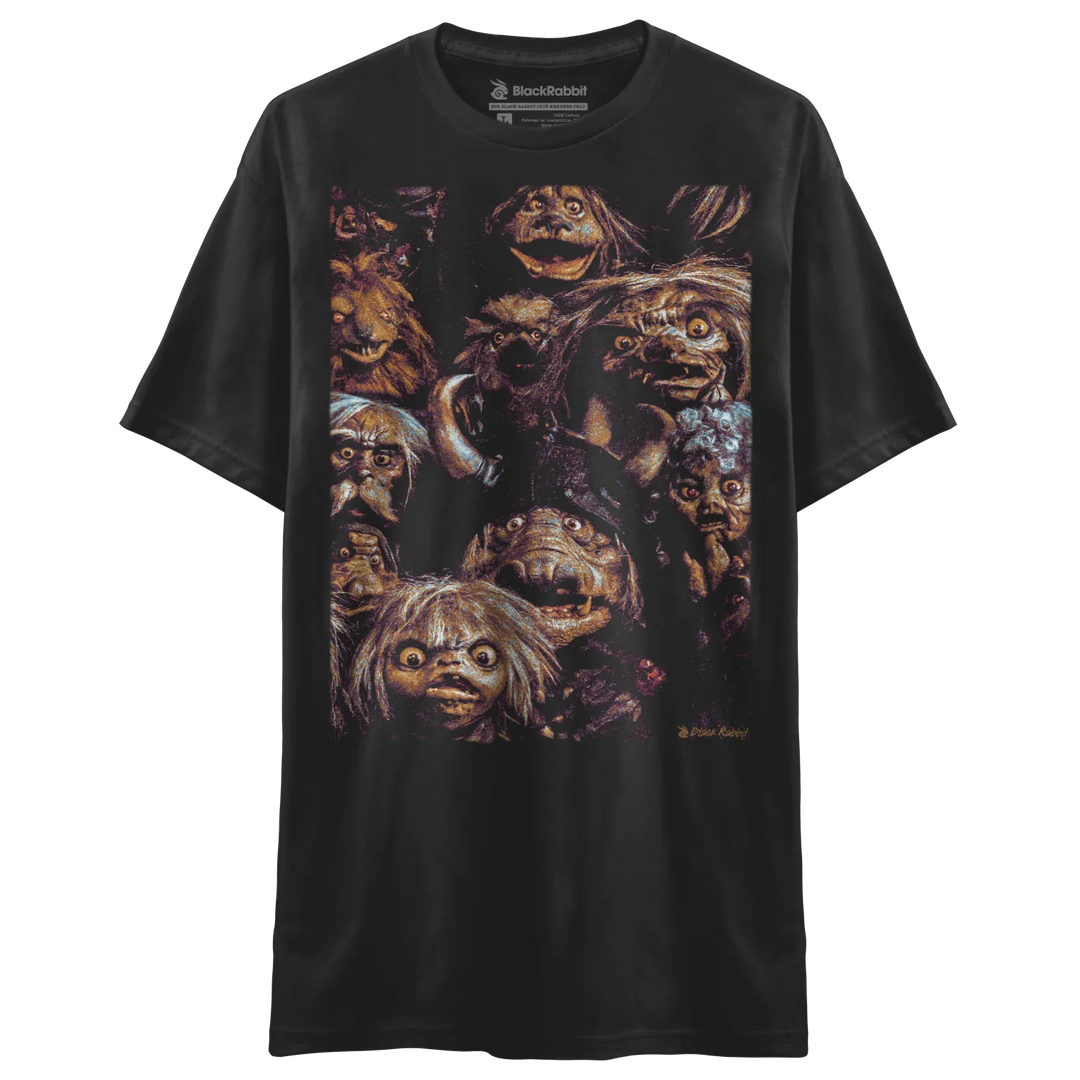 Black t-shirt with a graphic print of various monster faces.