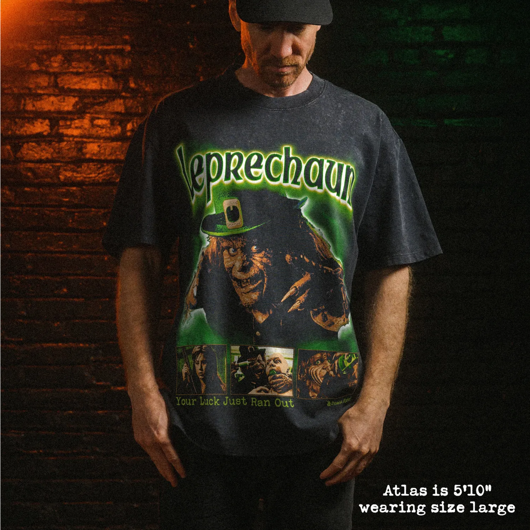 Male model wearing stone wash heavy tee with leprechaun graphic 