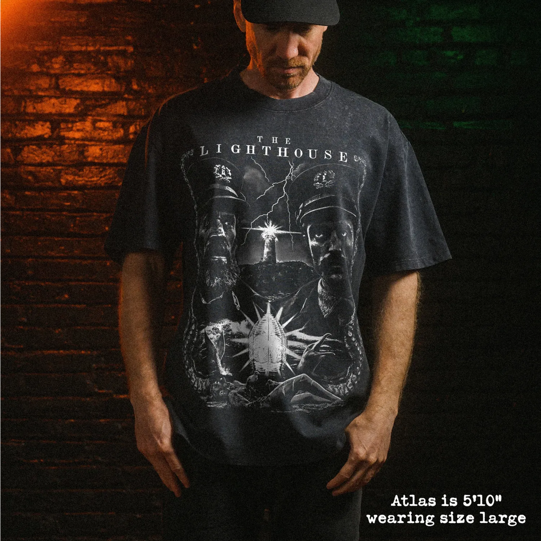 Male model wearing stone wash heavy tee with lighthouse graphic 