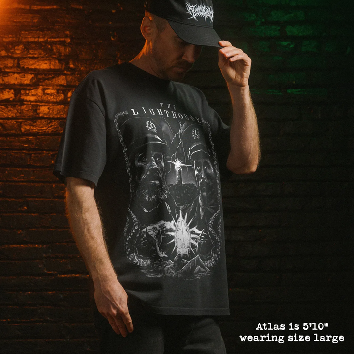Model wearing heavy tee with lighthouse graphic 