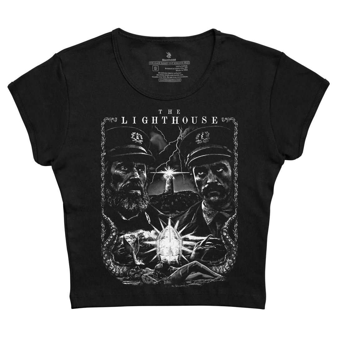 Black cropped t-shirt featuring a detailed white graphic of two lighthouse keepers with an octopus and a glowing lantern, printed by blackshot. 