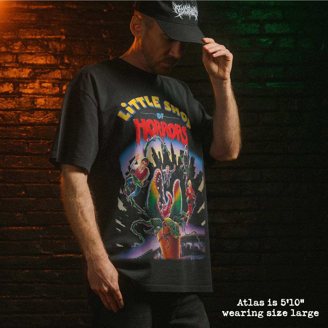 Model wearing heavy tee with little shop of horrors graphic 