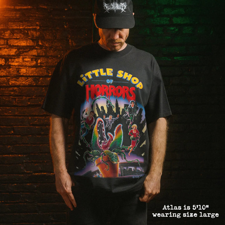 Model wearing heavy tee with little shop of horrors graphic 