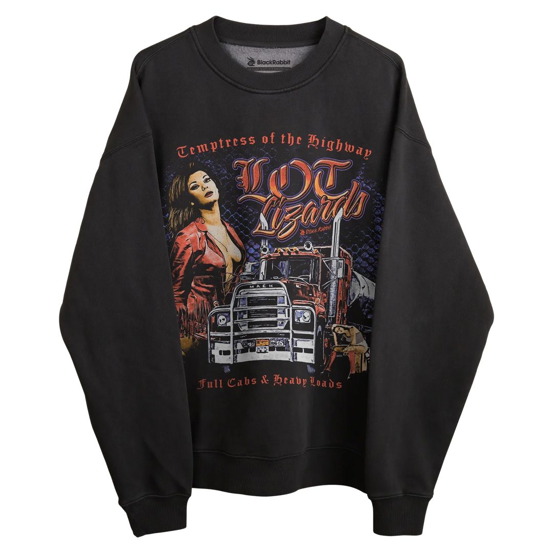 Black long-sleeved sweatshirt with graphic design of a woman and truck, featuring the text ’temptress of the highway’ in orange.
