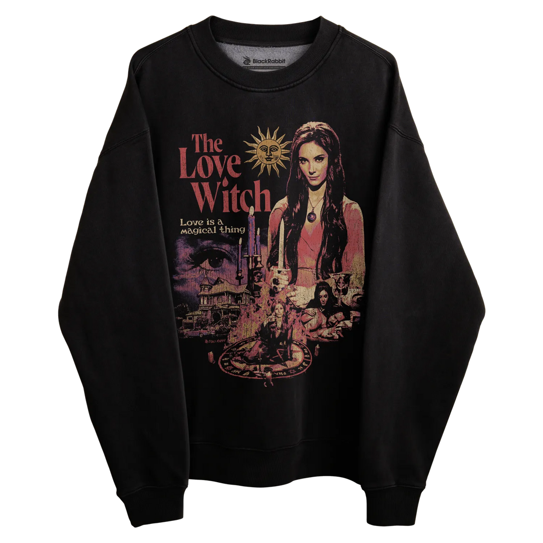 Black sweatshirt with ’the love witch’ graphic design featuring a witch and mystical elements.
