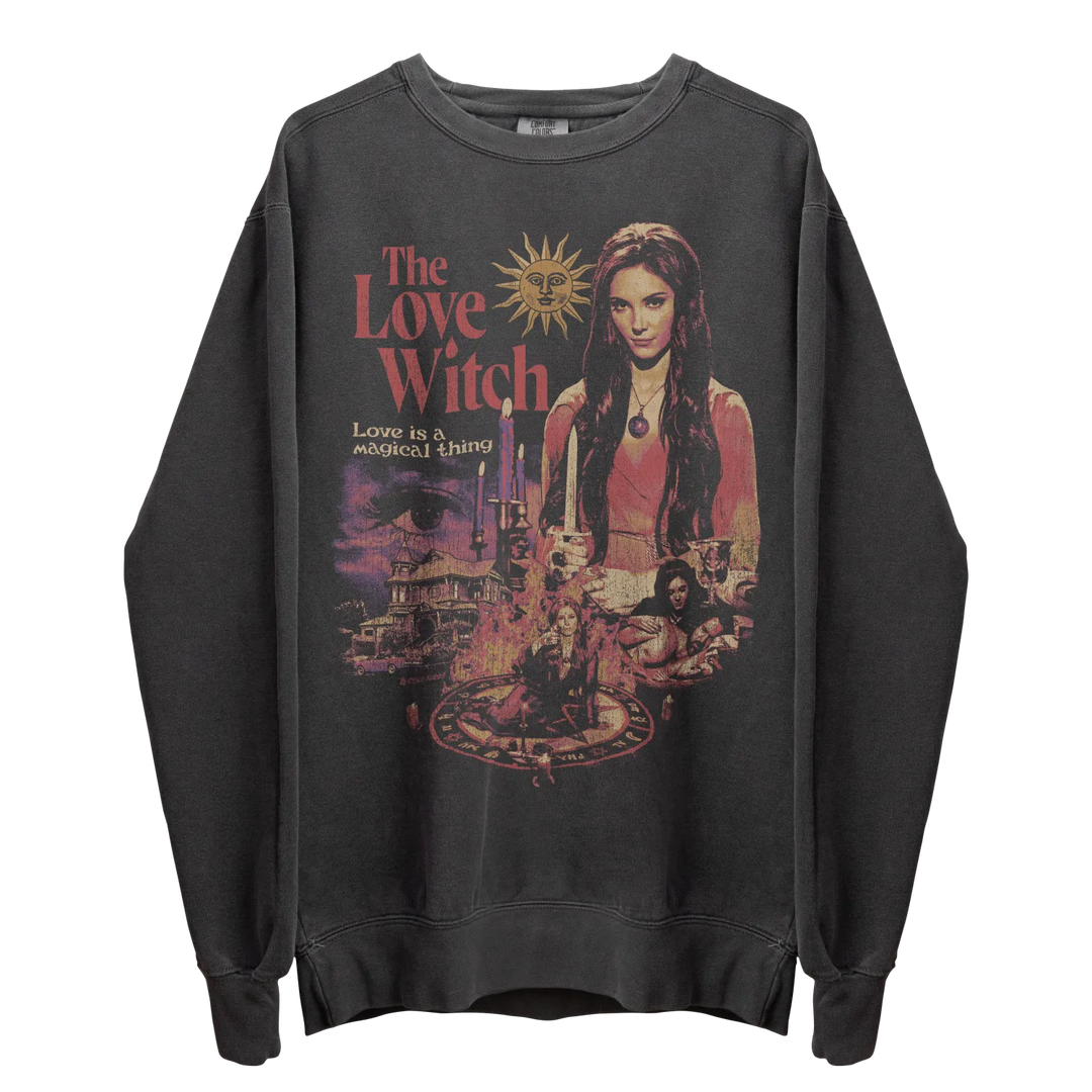Dark grey crewneck sweatshirt with a colorful ’The Love Witch’ graphic print.