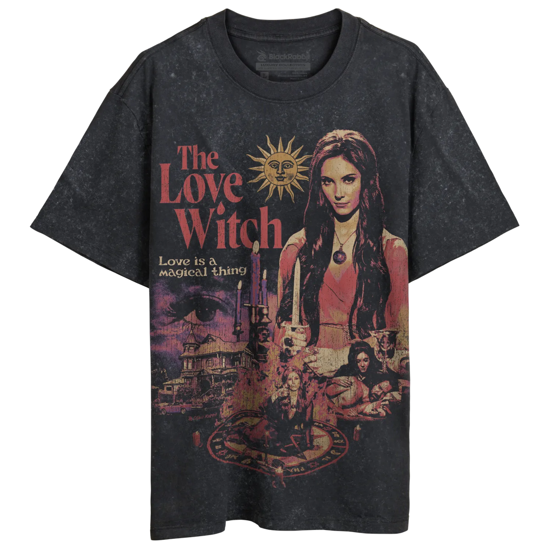 Dark gray short-sleeved t-shirt with a colorful graphic print featuring a woman, candles, and a sun.