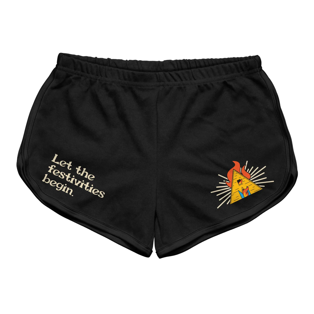 Black athletic shorts featuring a yellow pyramid graphic with flames and the phrase ’let the festivities begin’ in white lettering.