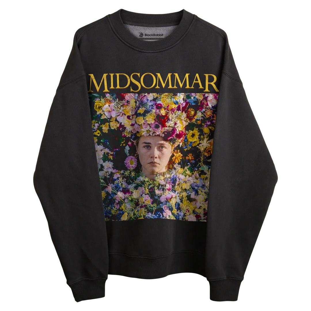 Black sweatshirt with ’midsommar’ text and floral design on front.