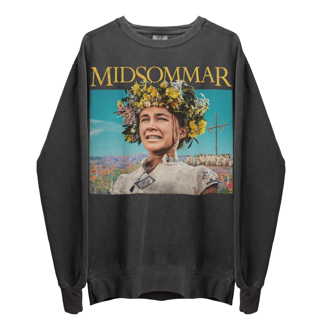 A dark gray long-sleeved sweatshirt featuring a colorful graphic print of a woman wearing a flower crown in a field.