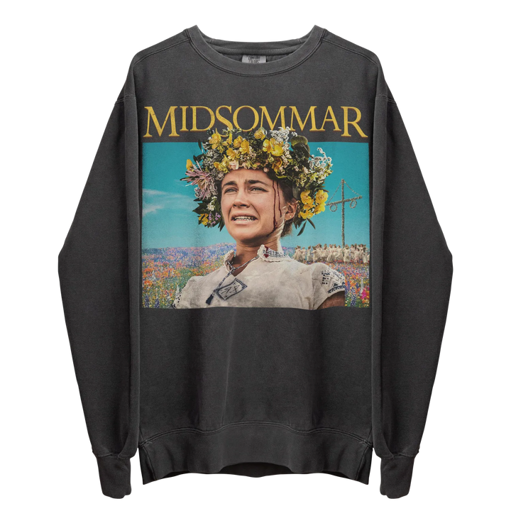 A dark gray long-sleeved sweatshirt featuring a colorful graphic print of a woman wearing a flower crown in a field.