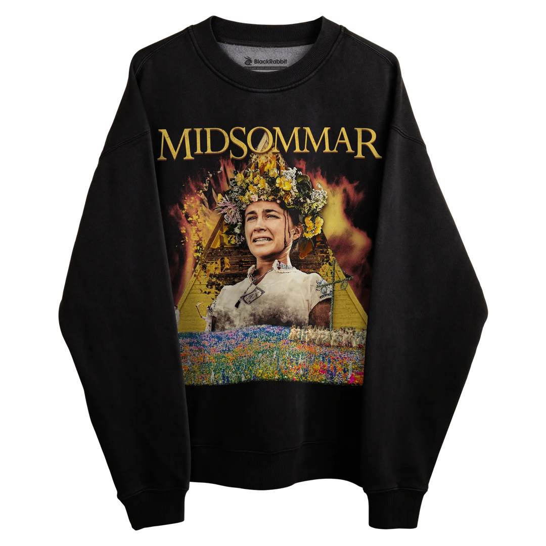 Black crewneck sweatshirt with ’midsommar’ graphic design featuring a woman in traditional attire surrounded by flames and flowers.