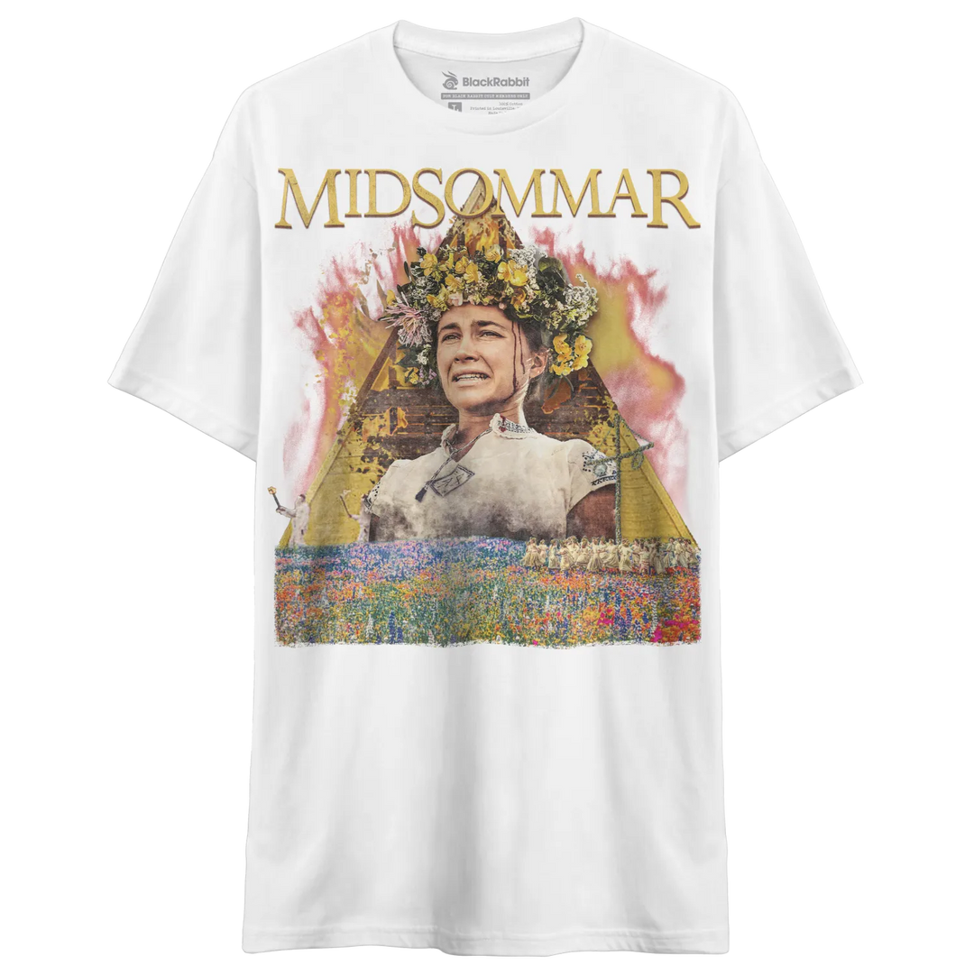 White short-sleeved t-shirt with a colorful graphic print of a woman in a floral crown and the word ’MIDSOMMAR.’