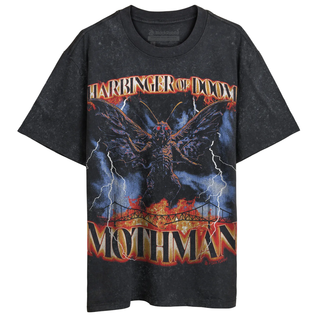 Black graphic t-shirt with a moth creature, lightning, and a bridge design.