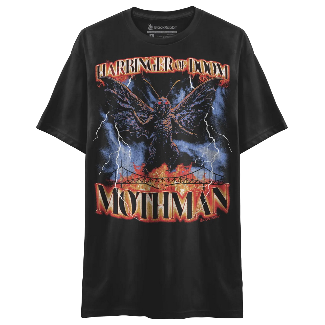 Black t-shirt with a graphic print of a winged creature, lightning, and a bridge.