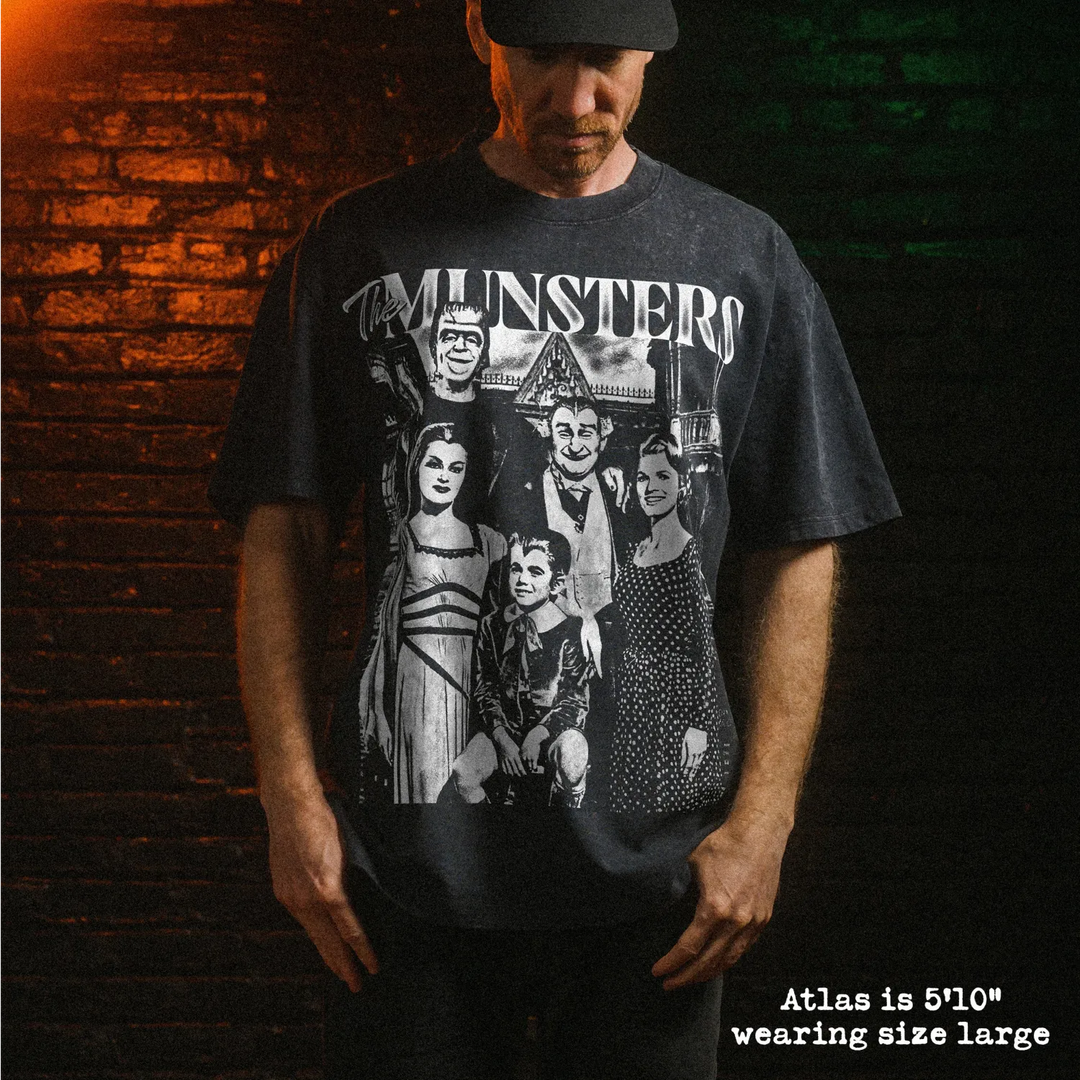 Male model wearing heavy stone washed tee with munsters graphic. 