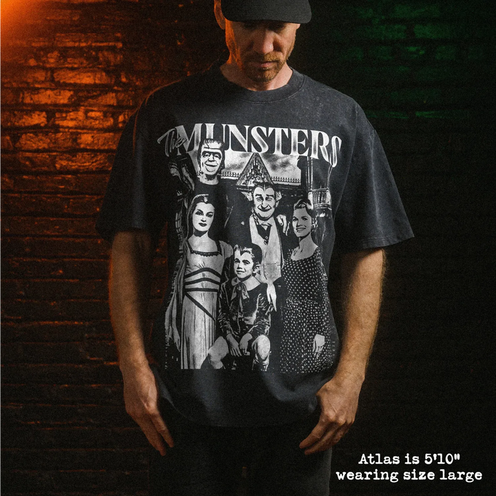 Male model wearing heavy stone washed tee with munsters graphic. 