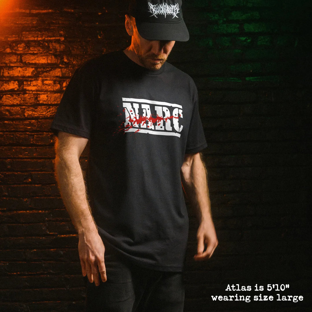 Male model wear soft premium tee with NARC graphic
