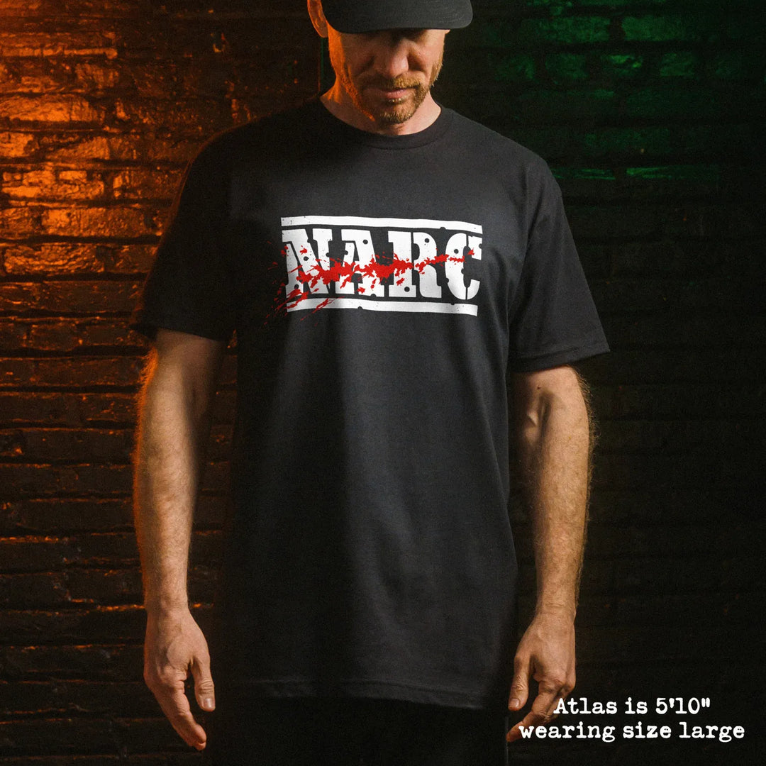 Male model wear soft premium tee with narc graphic
