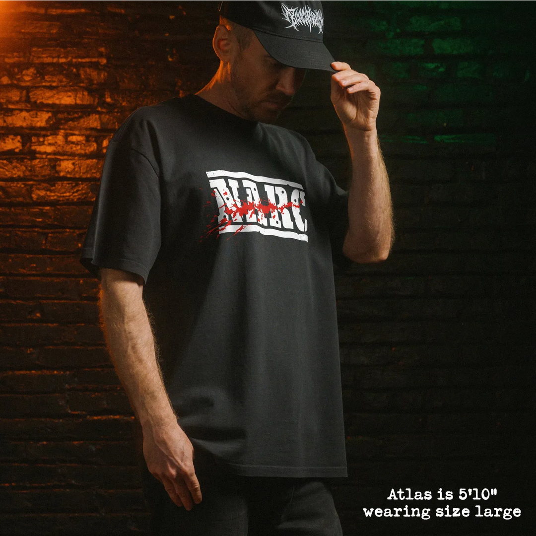 Model wearing heavy tee with narc graphic 