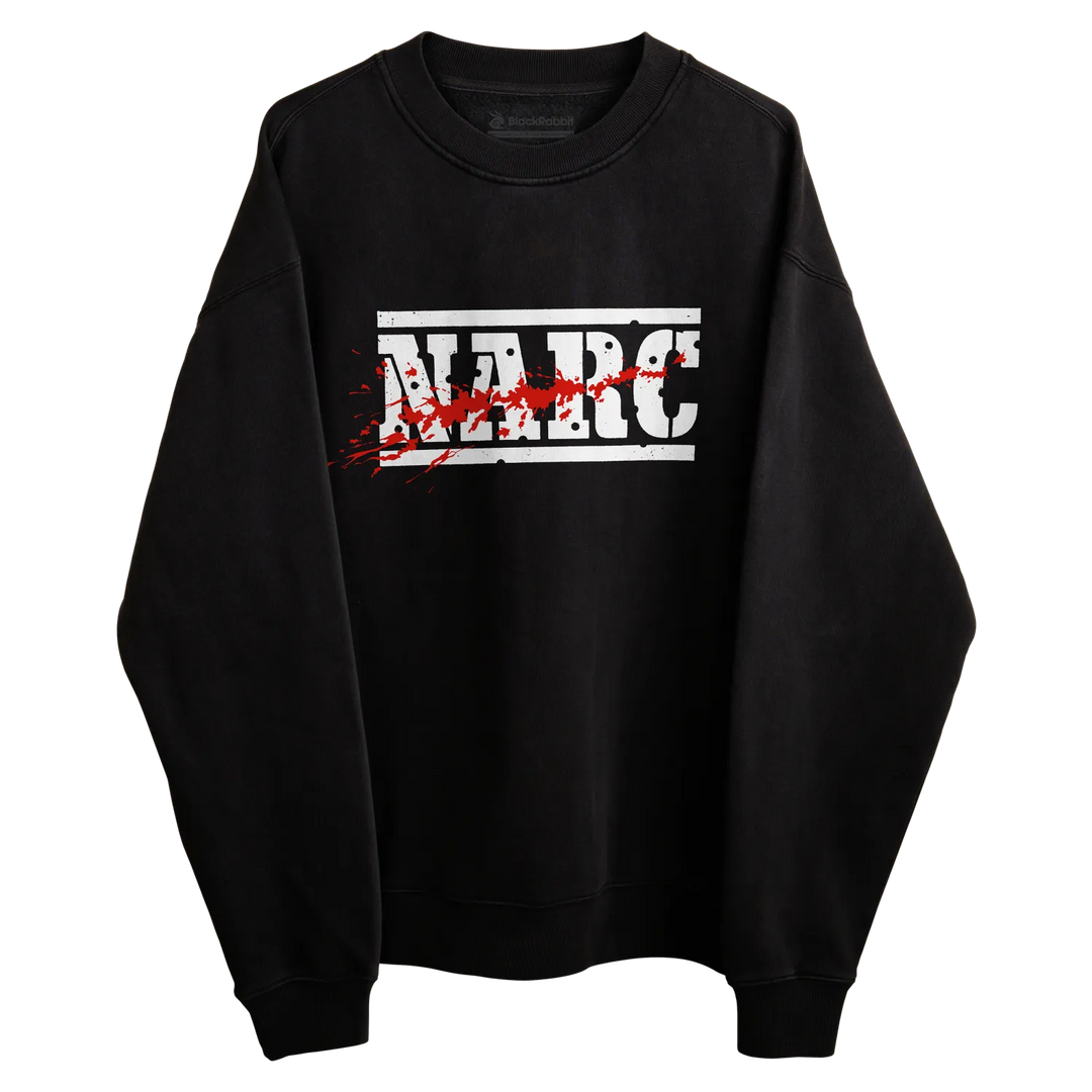 Black crewneck sweatshirt with bold white narc lettering and red splatter design inspired by 1988 arcade game preshrunk combed material