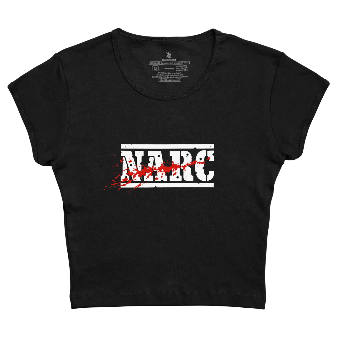 Black cropped t-shirt with bold white narc graphic and red splatter effects made from preshrunk combed fabric for arcade game fans
