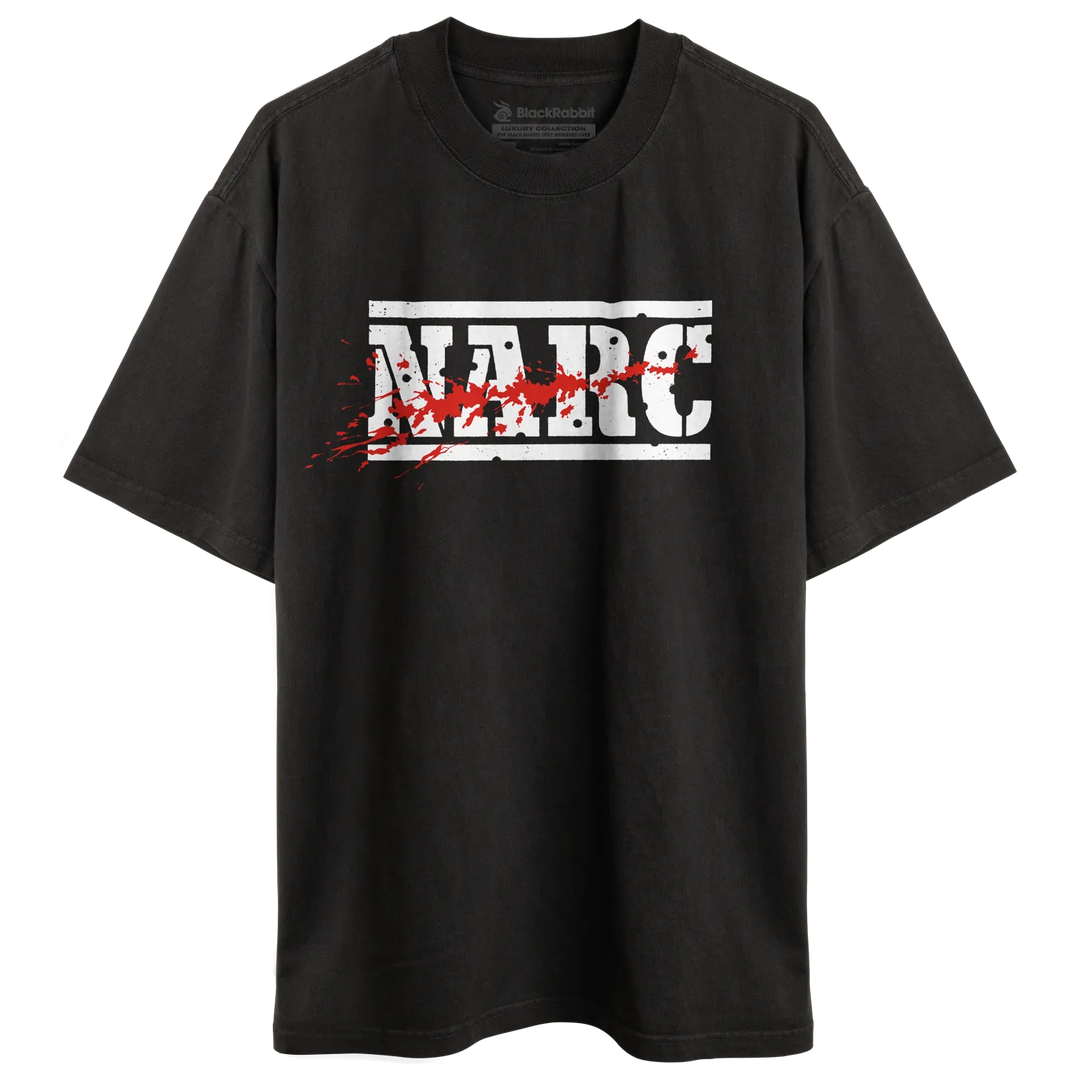 Black short-sleeved preshrunk combed t-shirt with bold white narc arcade game logo and red splatter effects vintage retro gaming