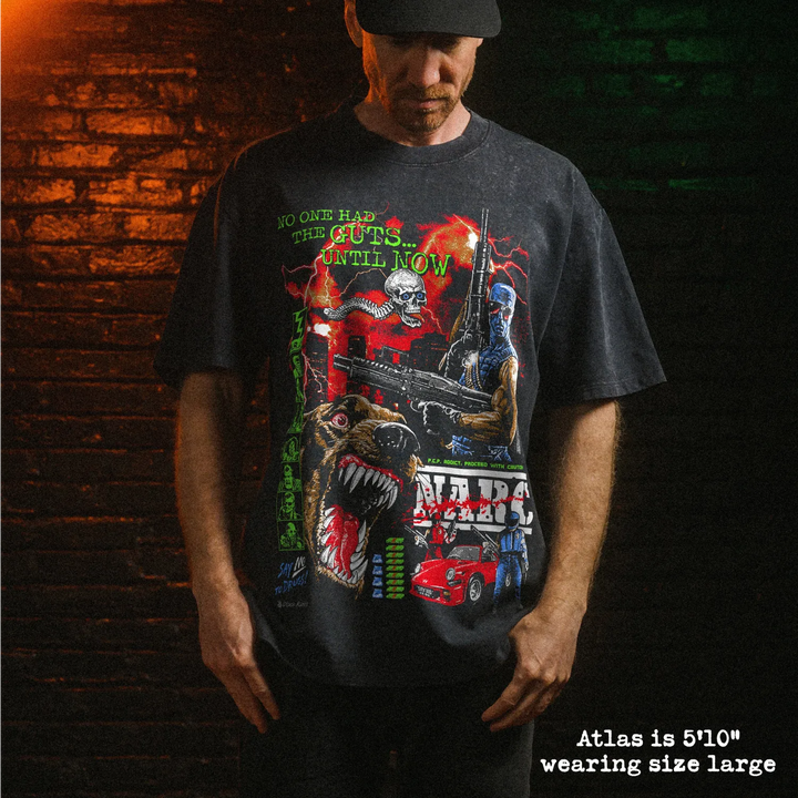 Male model wearing Black Rabbit Stone Wash Oversized Luxury Heavy Tee with NARC print. He is 5'10" and wearing a size large.
