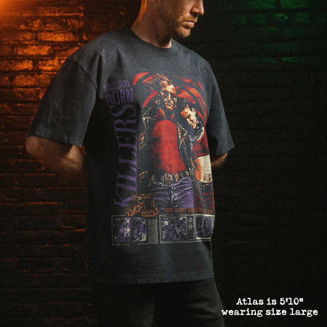 Male model wearing stone wash heavy tee with natural born killers graphic 