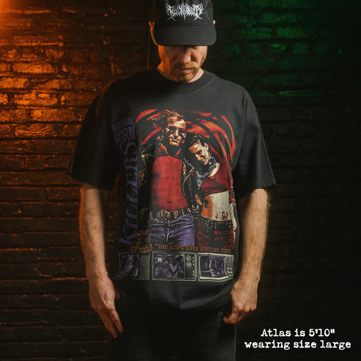 Model wearing heavy tee with natural born killers graphic 